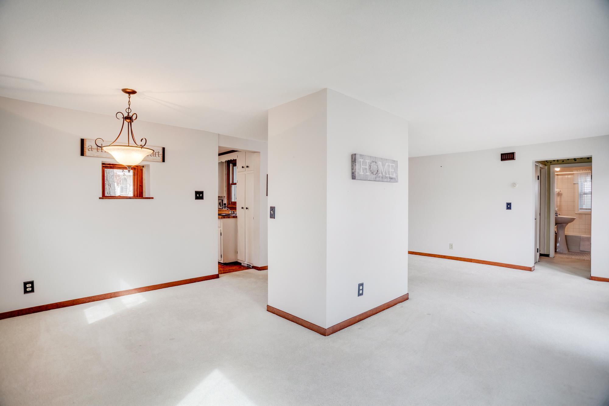 The dining room connects easily to the adjoining living room + offers direct access to the kitchen. This versatile main level could be configured and utilized in a variety of ways to fit your needs.