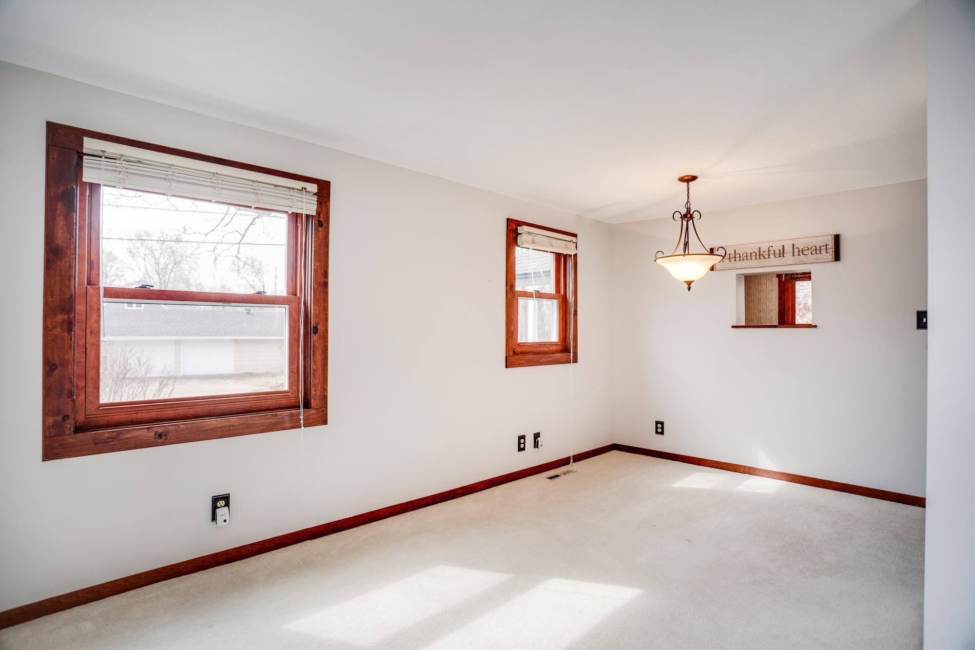 View of the dining room looking towards the kitchen. There is even a small pass-through from the kitchen to the dining room.