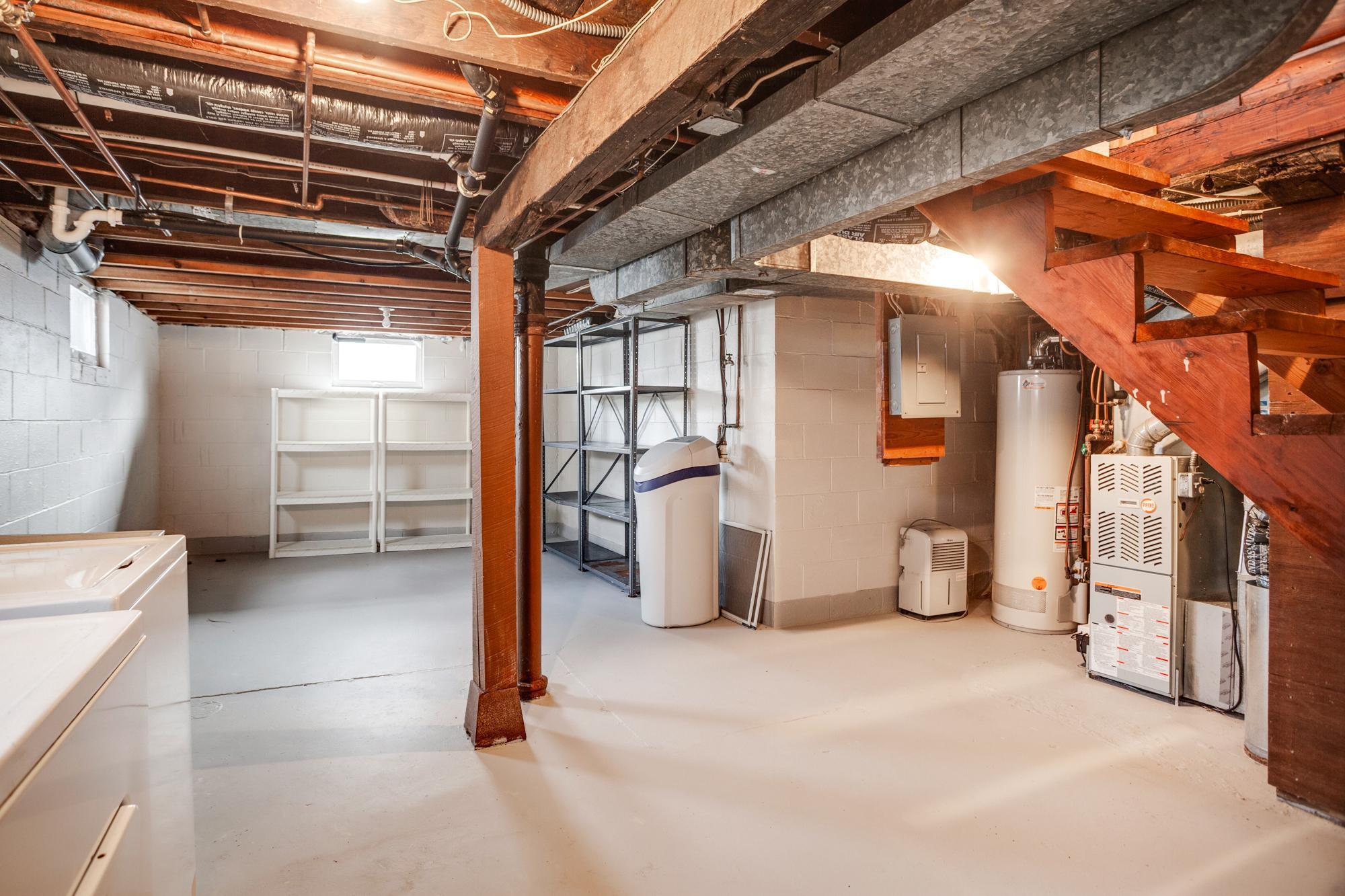 All of the mechanicals are tucked away so you have plenty of open space for storage or even an exercise area.