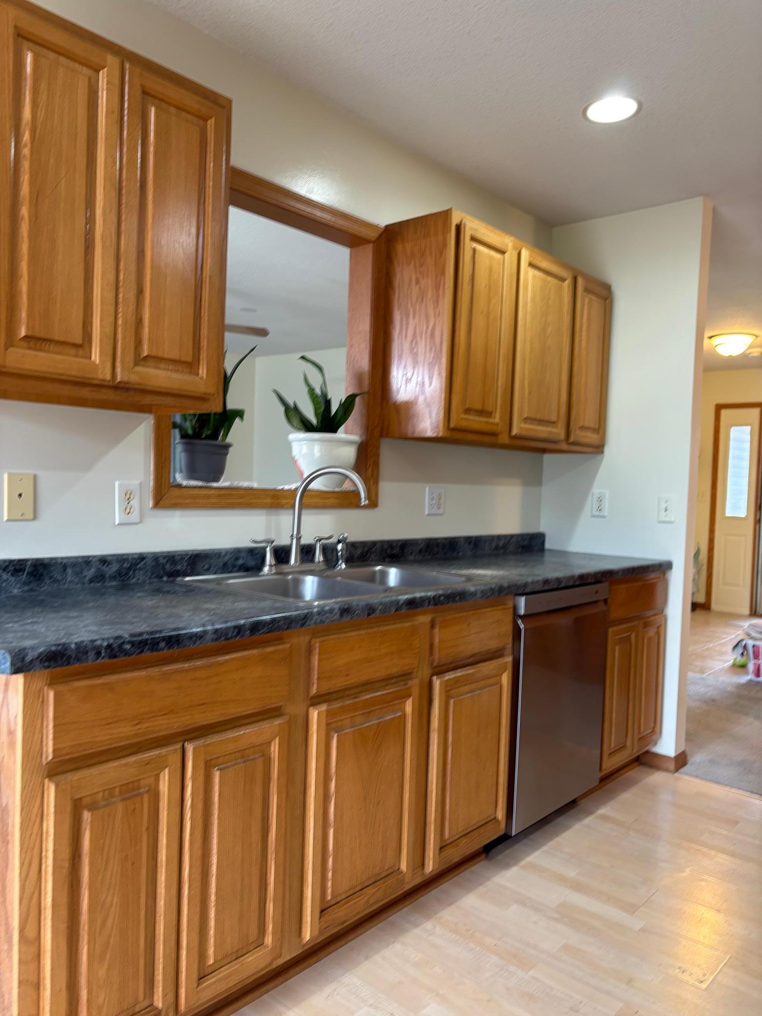 kitchen sink area and opening into living room.
