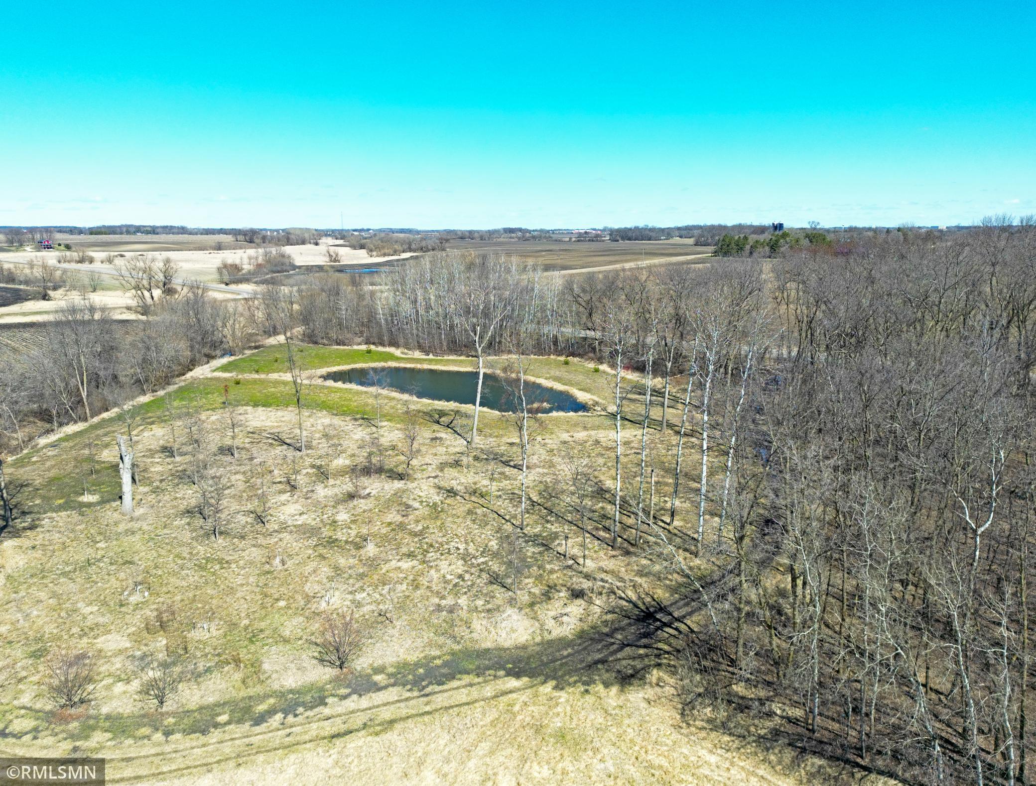 The northeast corner has been completely reimagined through significant earthwork, raised terrain, and carefully planted clover and grasses to support both function and habitat.
