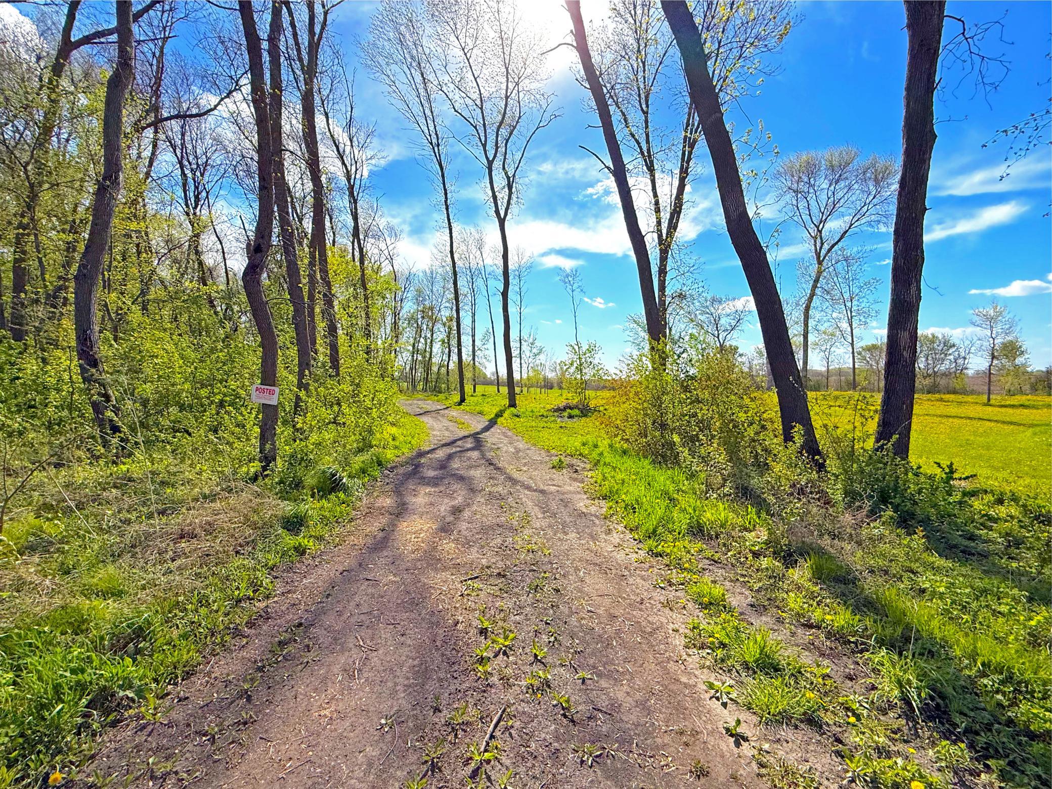 A 6-acre tillable hay field anchors the property and leads to a building site, perfectly positioned to capture scenic views featuring the newly created pond and surrounding woods.