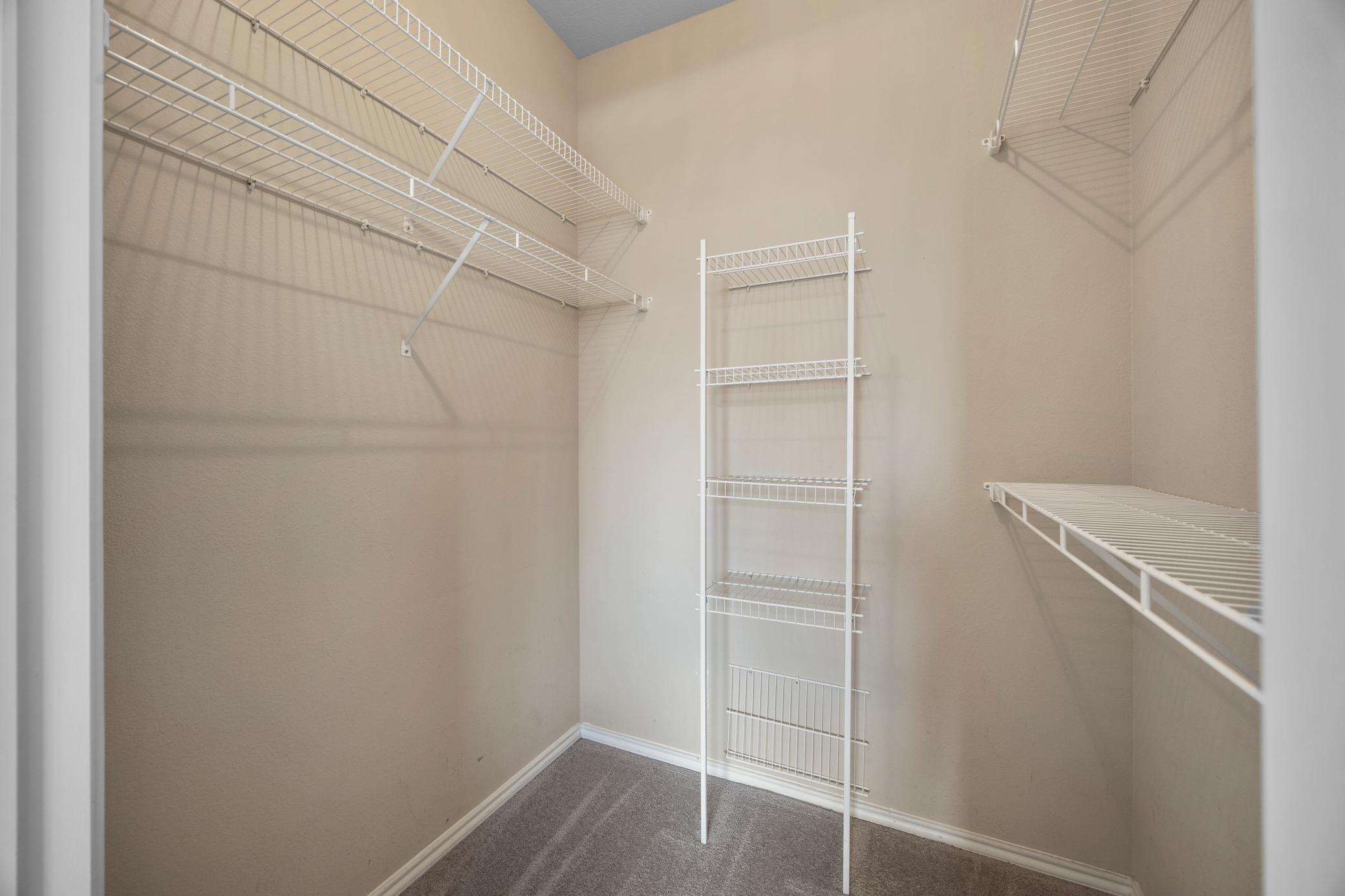 Walk-in closet. In addition to this closet - there is a storage unit available to this condo.