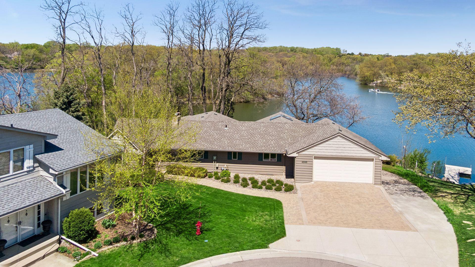 Enjoy 250 feet of private lake shore on this 1 acre lot