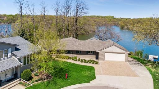 Enjoy 250 feet of private lake shore on this 1 acre lot