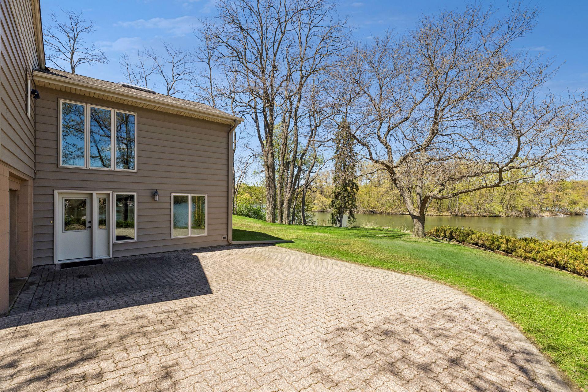 Expansive patio accessible from sun room in walk-out basement