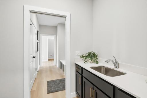 Ideal & perfect the laundry is located between primary bath & mudroom space.