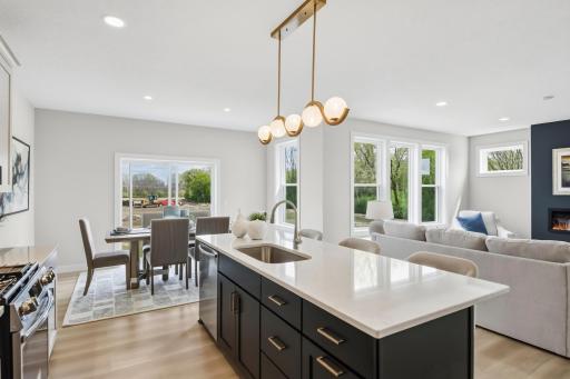 Love the gold accents tied into the blues and white accents- this is a must see home.