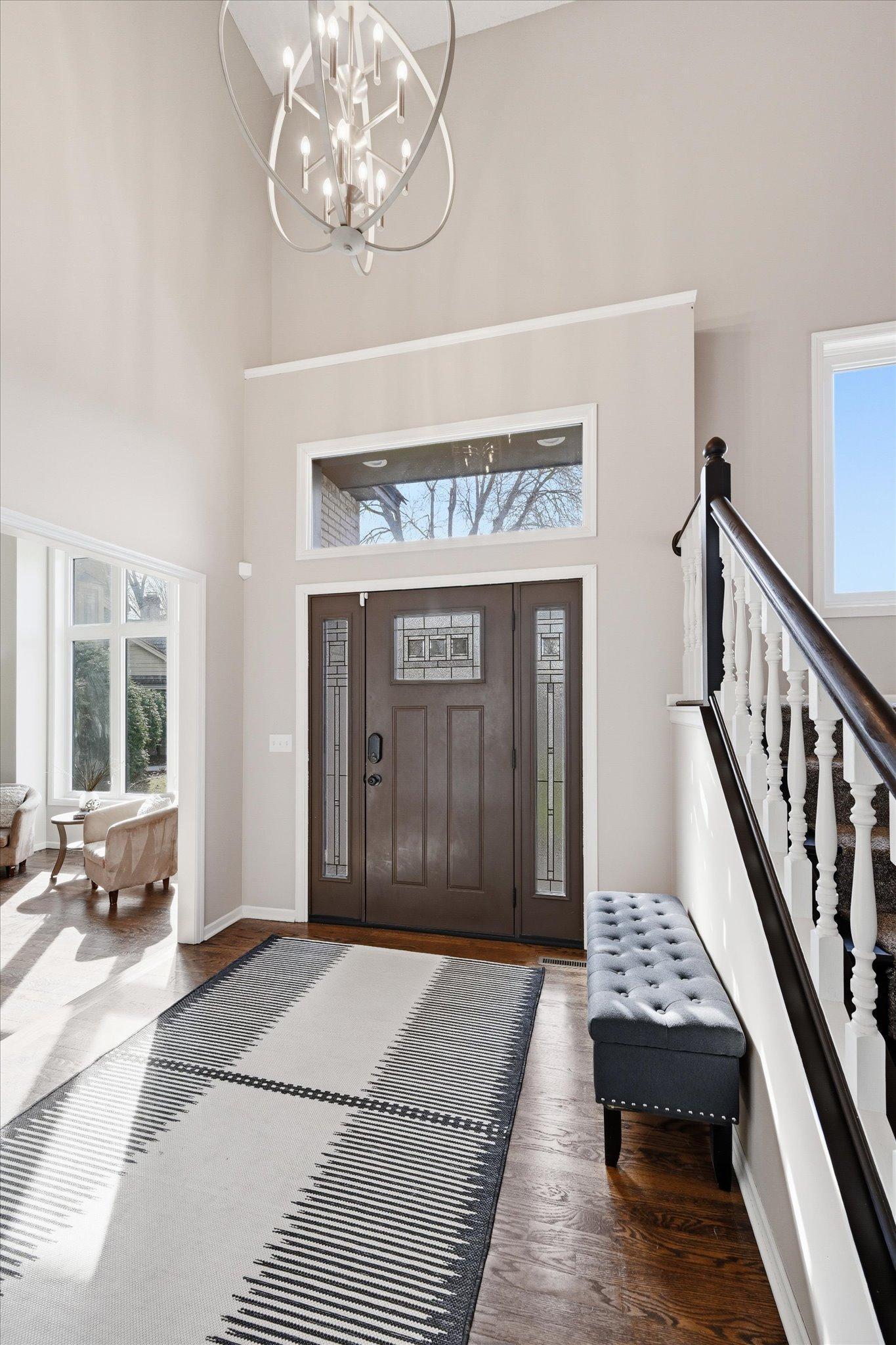Welcome home! Grand foyer with large closet and gleaming walnut color solid wood floors.