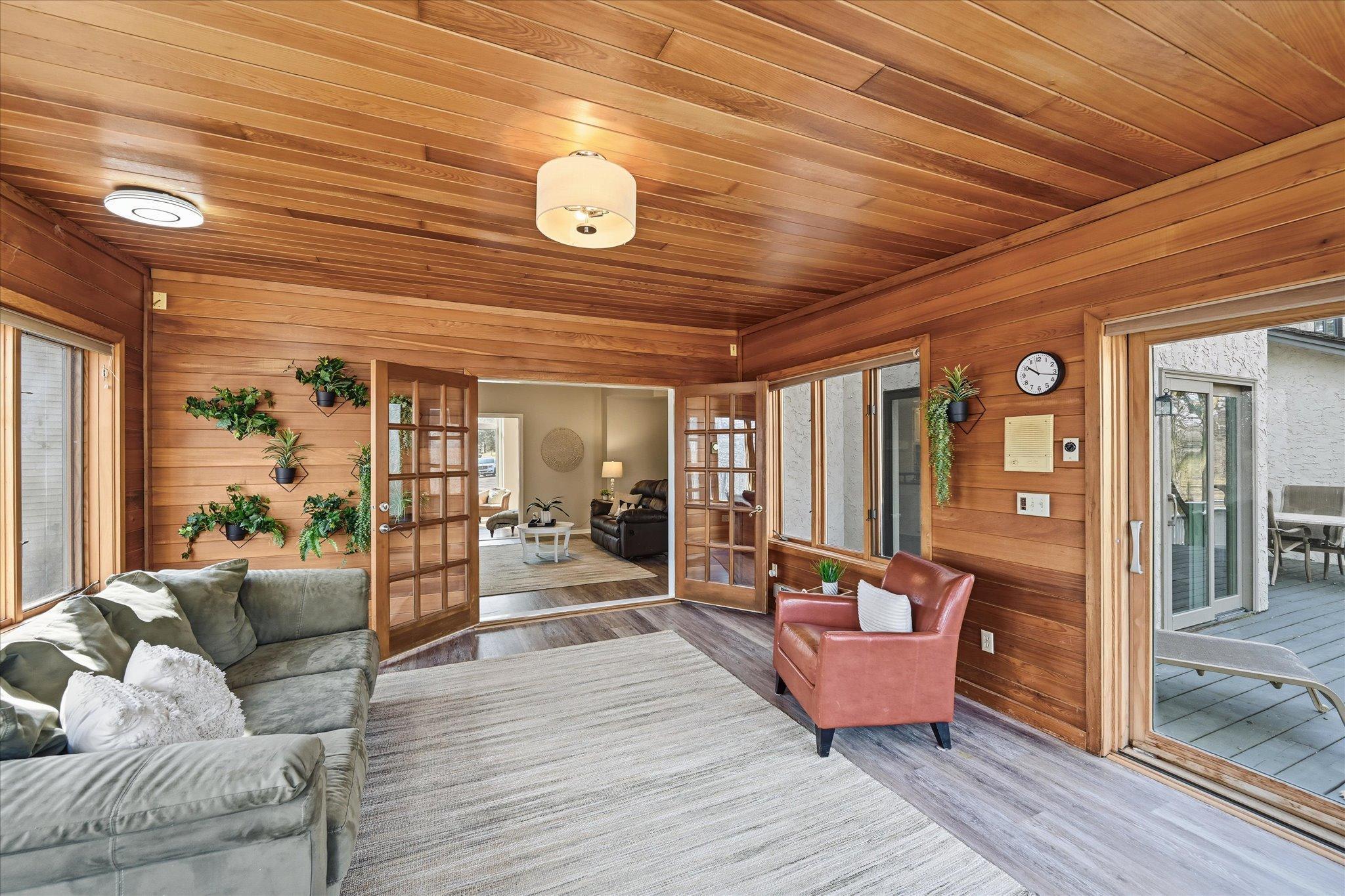 With ample space, this four season room truly hits all the marks, tranquility, beauty, functionality leading to large deck and large enough for most any furniture for comfort.