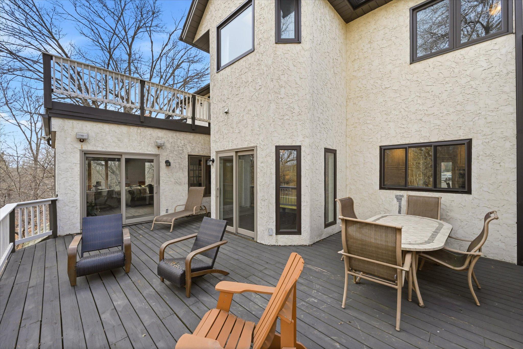 Just a part of the massive outdoor living area. Notice the deck above the four season room as well.