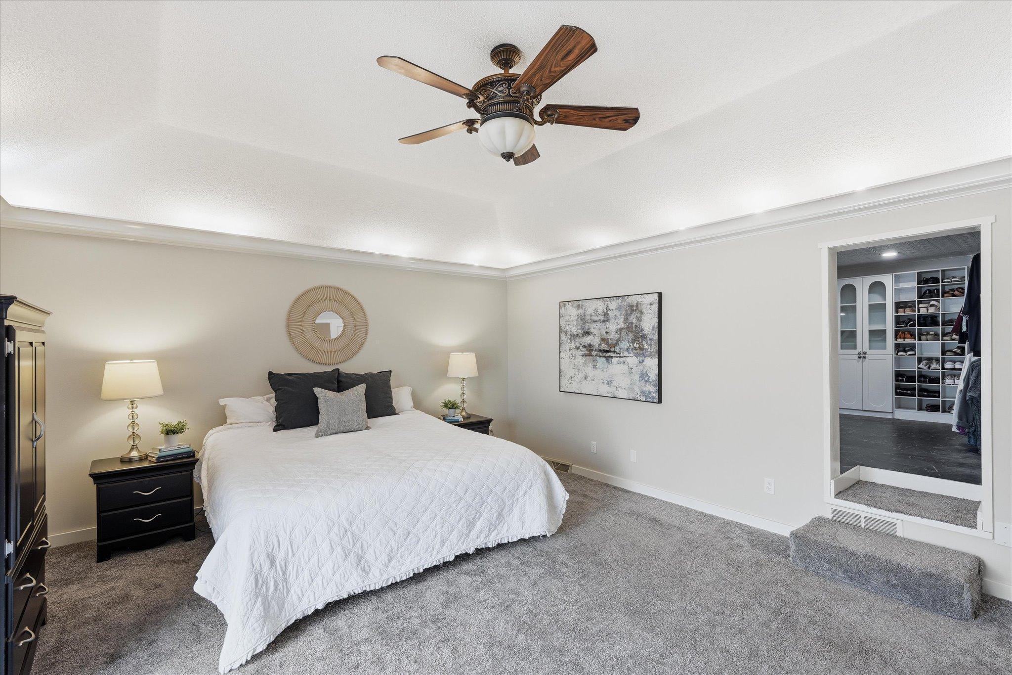 Primary suite! Highlights are: 14x13 closet PLUS a second walk in closet within en suite area, sliding doors to a large private deck, remodeled en suite bath with double vanity, separate tub, tiled shower and private washroom.