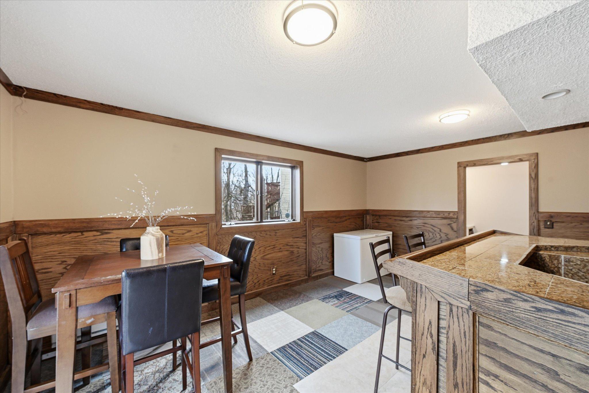 Bonus space in the lower level with bar and game space walkouts out to patio and private backyard