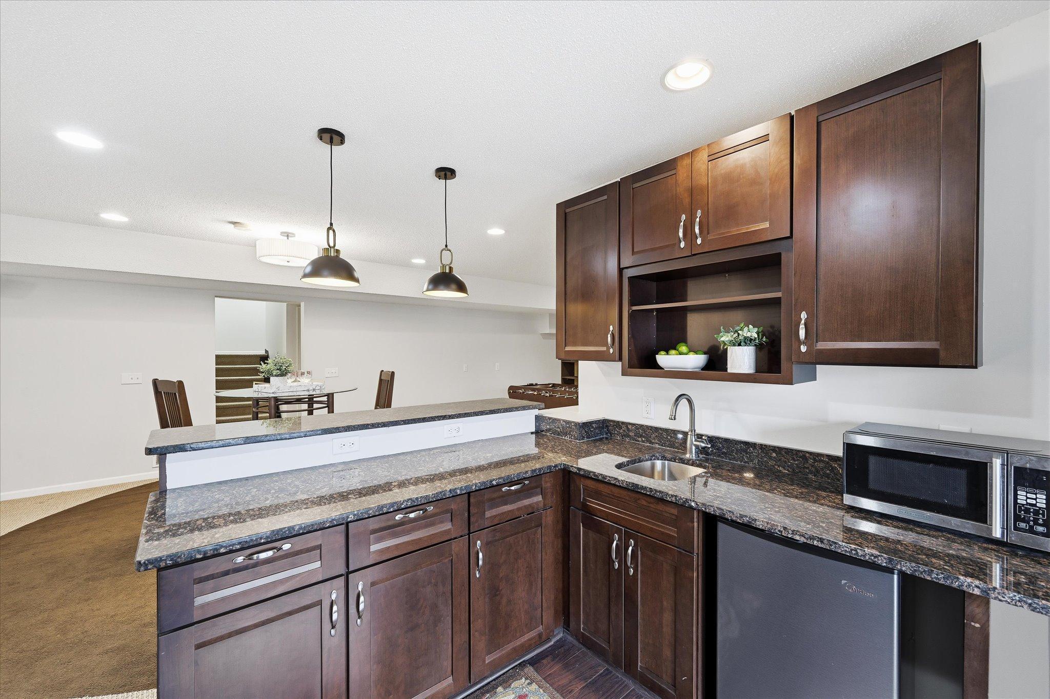 Lower level beautiful bar!! Walkouts out to outdoor entertaining space.