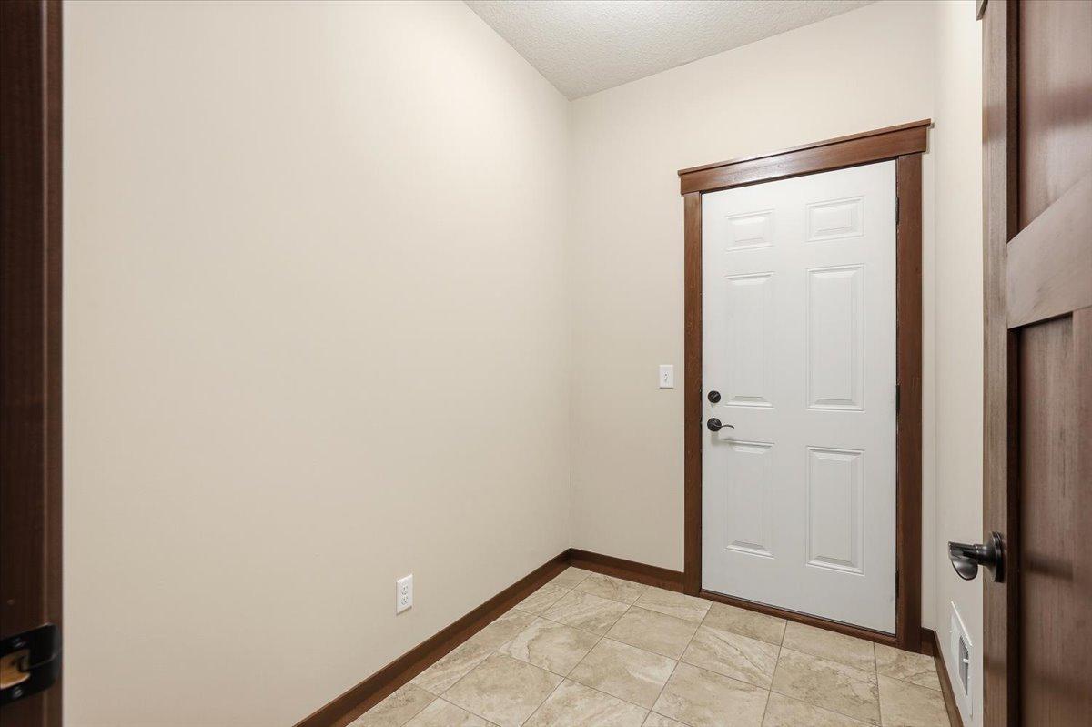 32-Entrace from garage. Good size walk-in closet here but not pictured.jpg