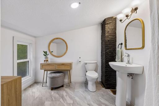 Private owners bath with walk-in tiled shower.
