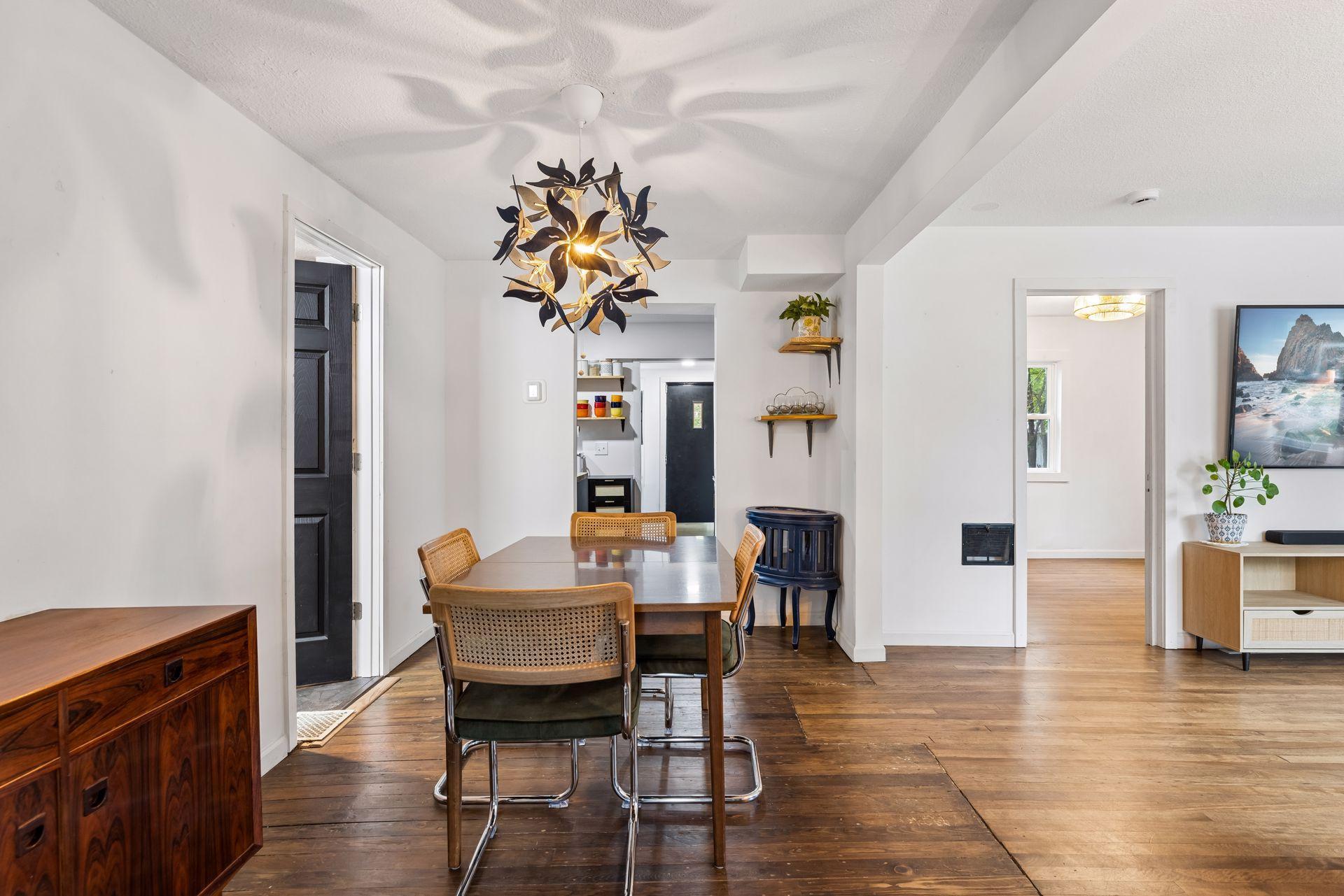 Informal dining room with unique light fixture.