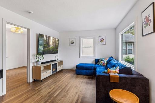 Hardwood floors in the living room, main floor bedroom, dining and sun room.
