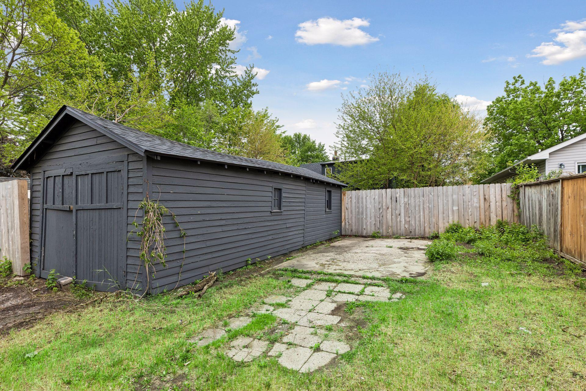 1+ car tandem style garage with additional concrete parking pad.