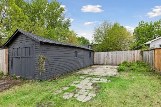 1+ car tandem style garage with additional concrete parking pad.