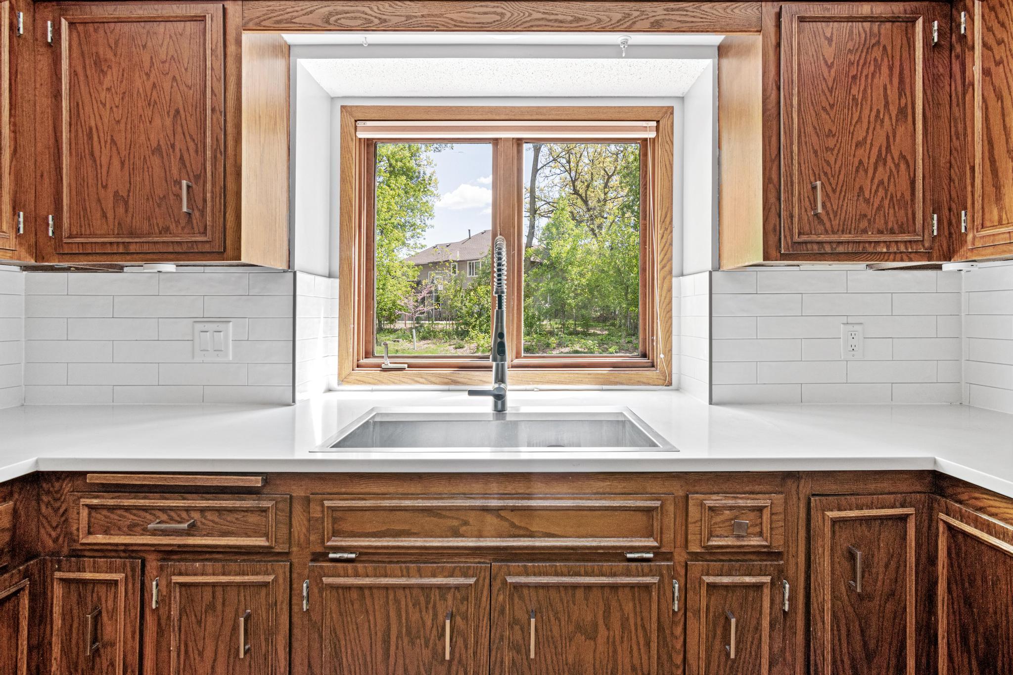 Kitchen window looking out to the backyard