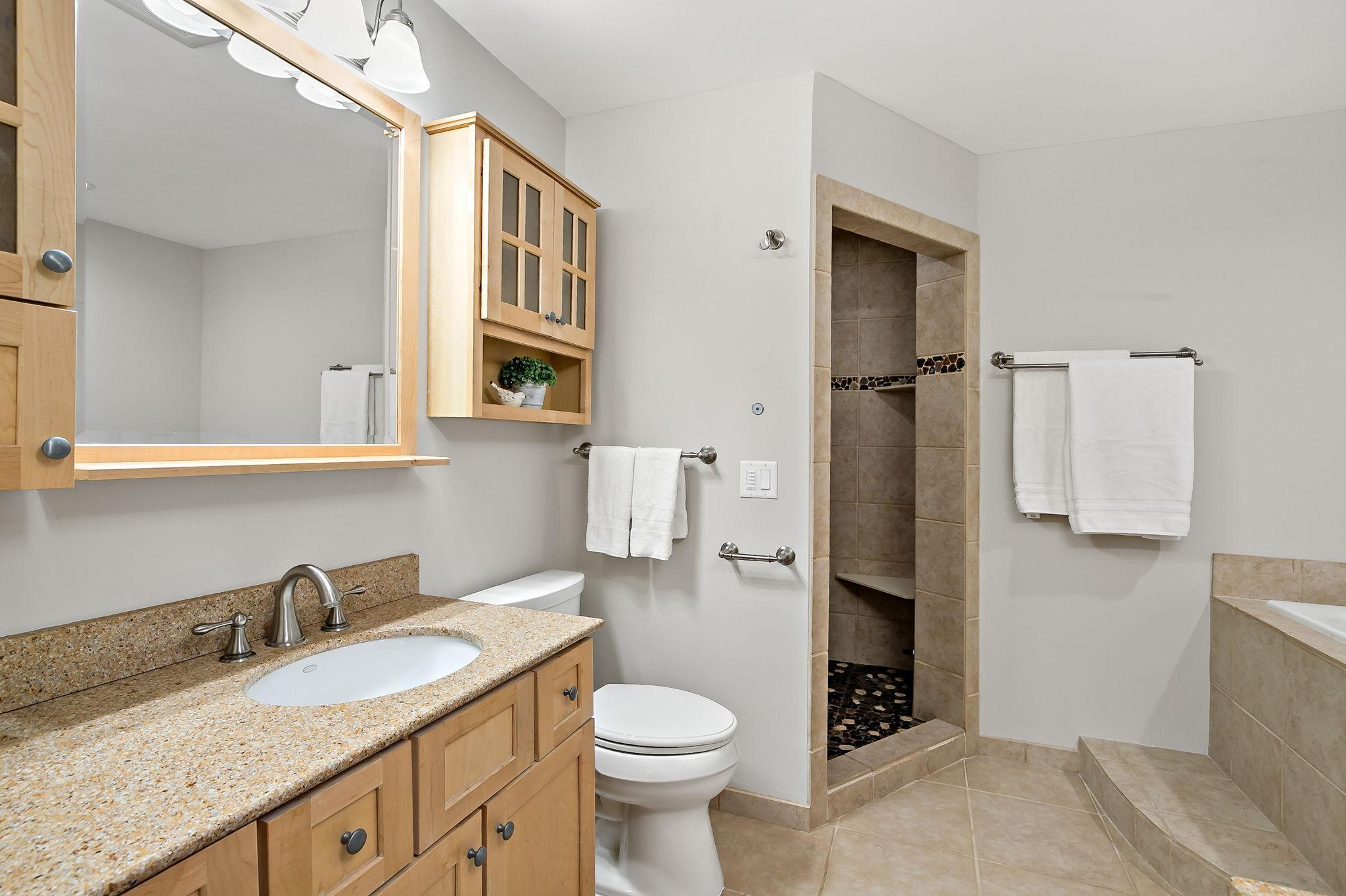 Private Ensuite Featuring a Steam Showe r& Jacuzzi Tub