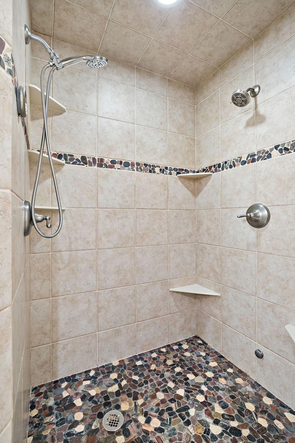 Private Ensuite Featuring a Steam Showe r& Jacuzzi Tub