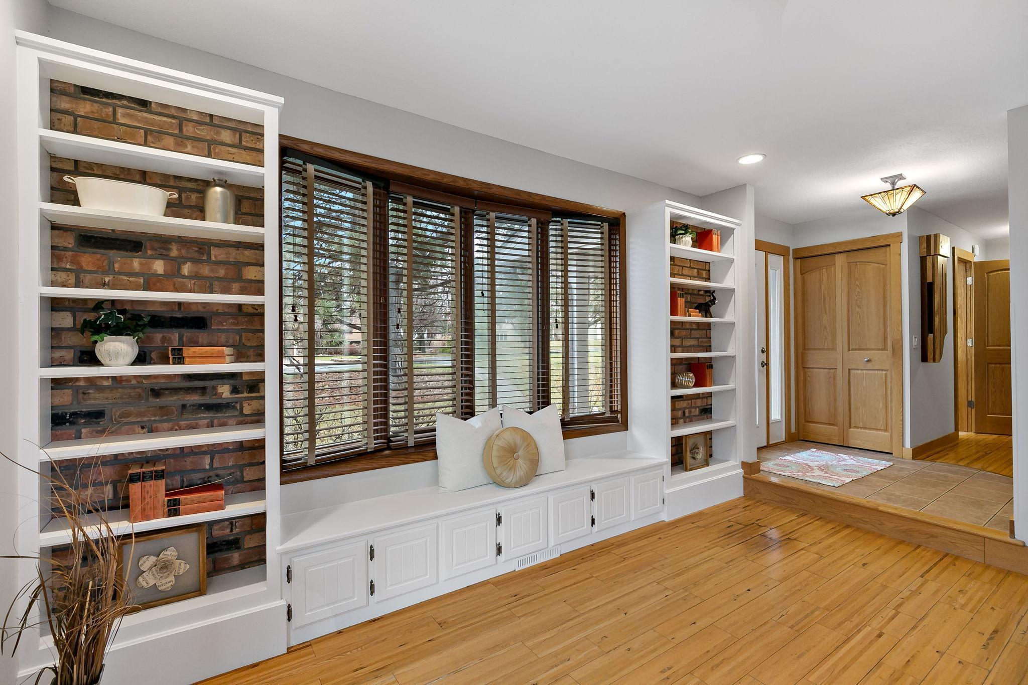 Bright & Comfortable Living Space with Hardwood Flooring