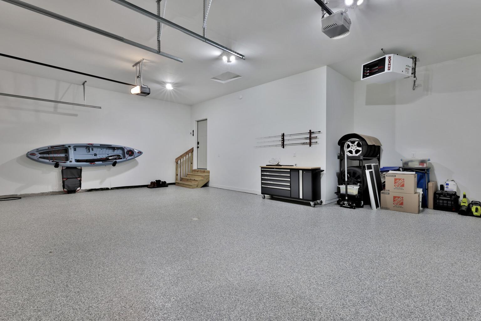 Beautiful epoxy floors in garage + EV charging ready