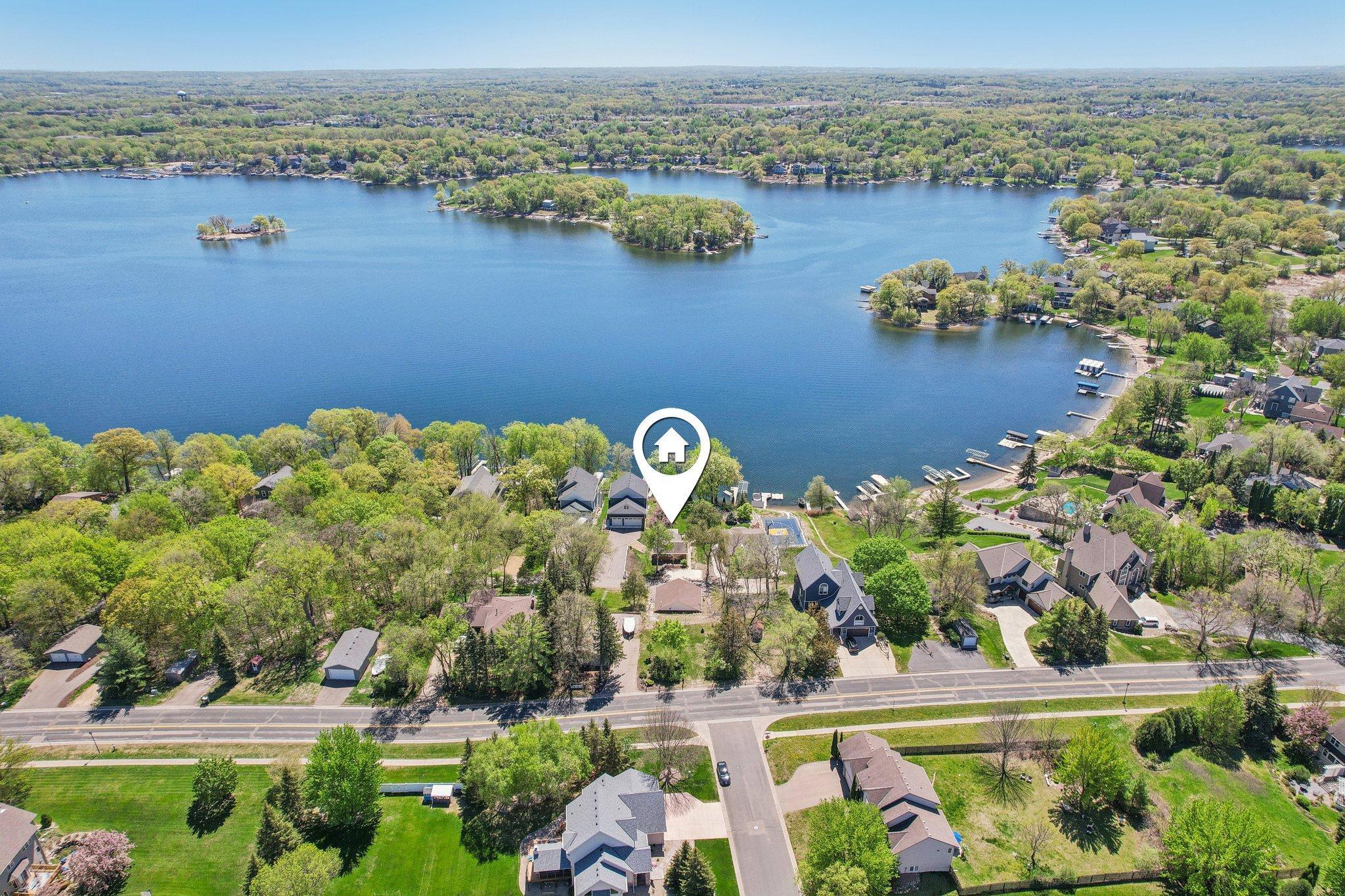 Perfectly positioned along the tranquil shores of Prior Lake on a private, picturesque 0.48-acre lakeshore lot, this inviting bungalow effortlessly blends cozy lakeside living with exceptional functionality.