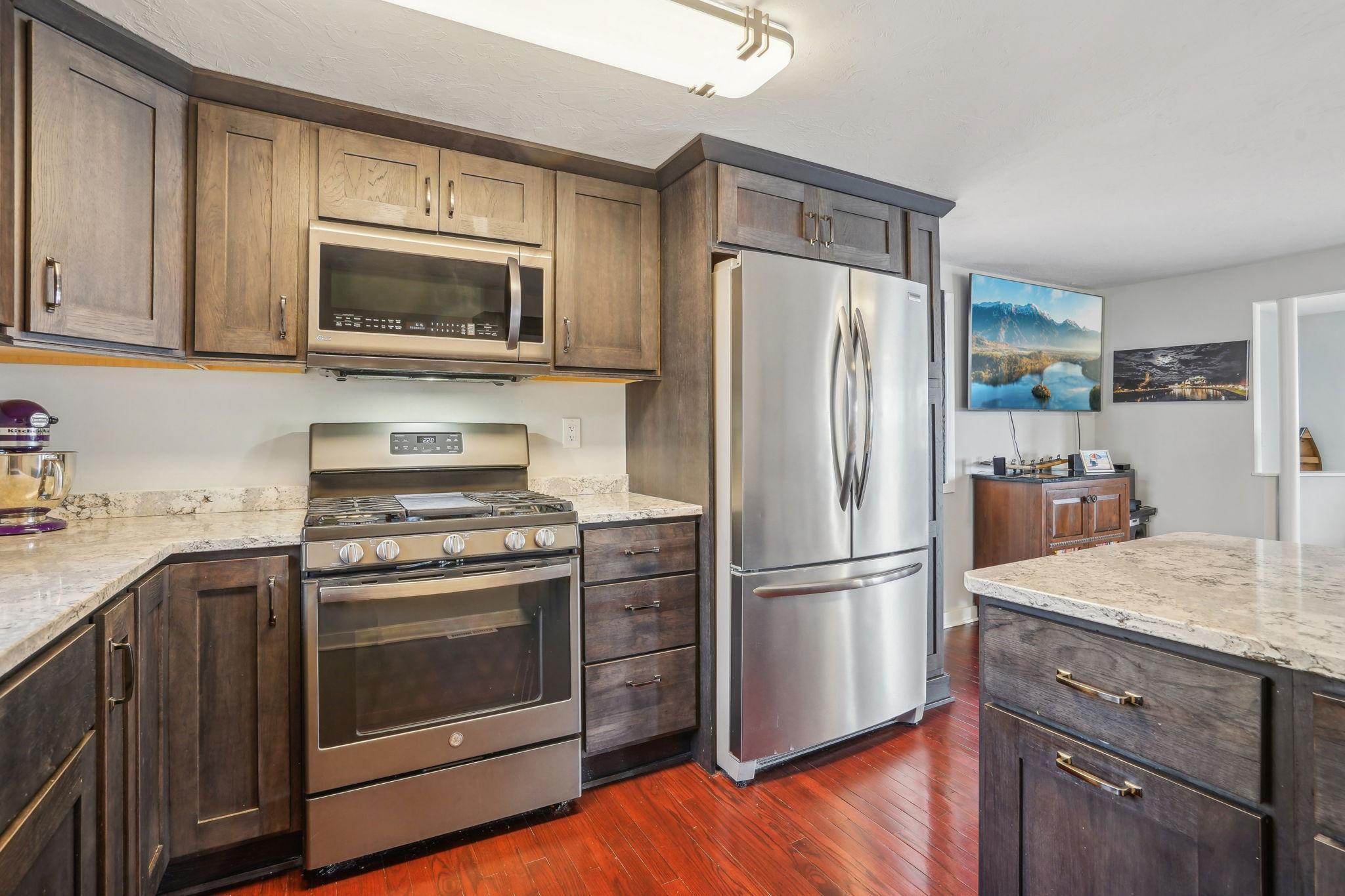 The kitchen offers the perfect space for cooking, with ample counter space, and a functional layout.