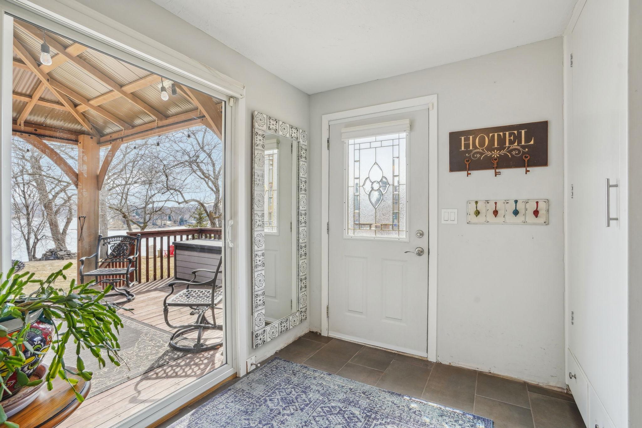 The front door offers convenient access directly off the deck.