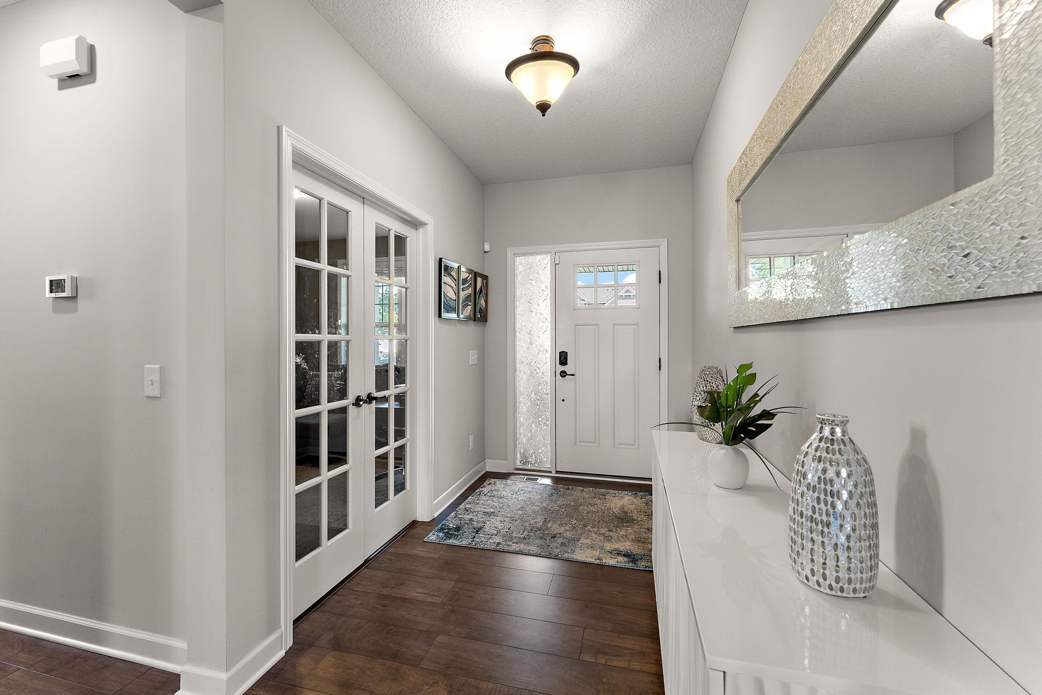 Welcoming entry space with the office or flex room just off the front door.