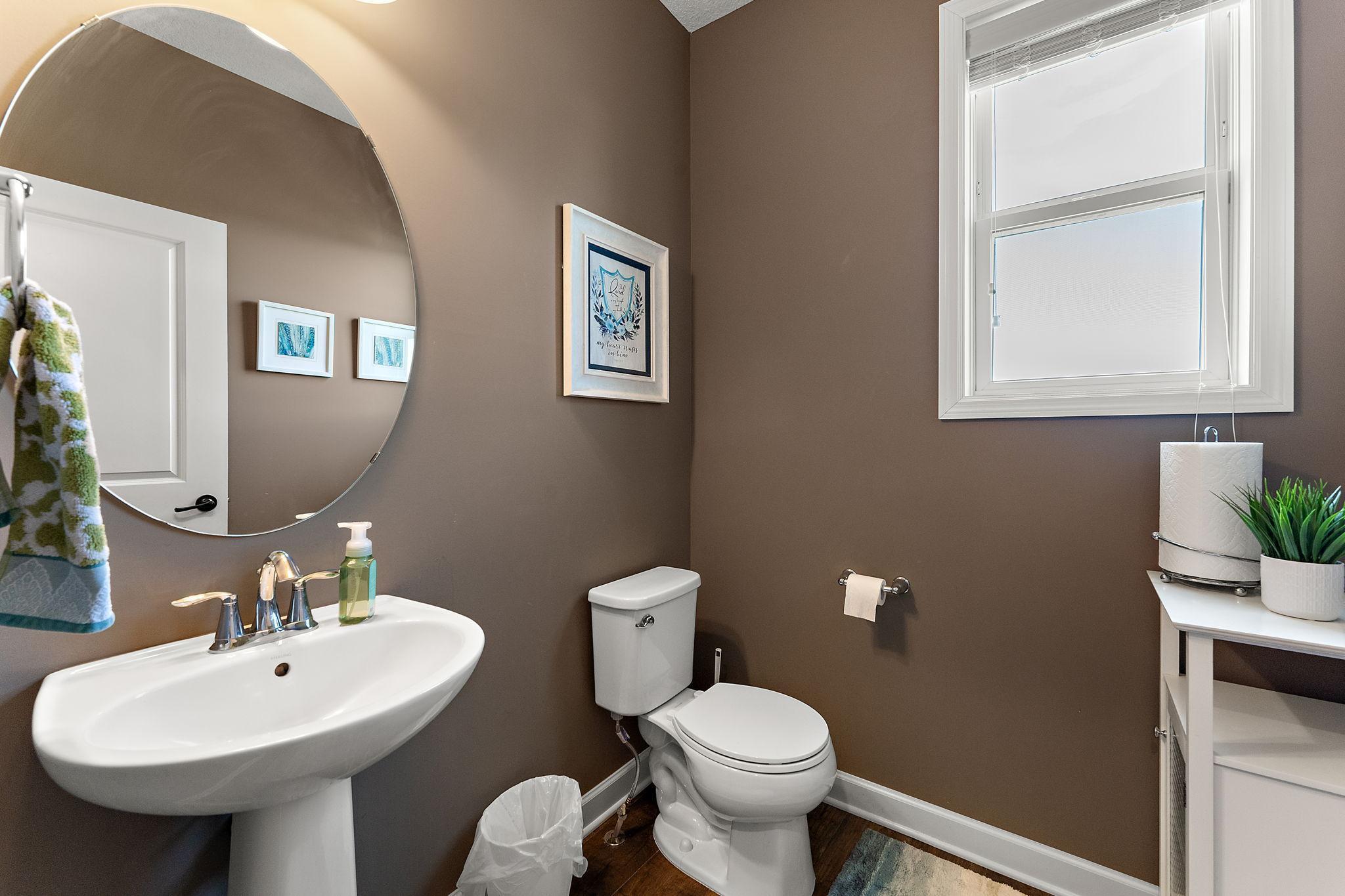 Convenient half bath just off the main hallway