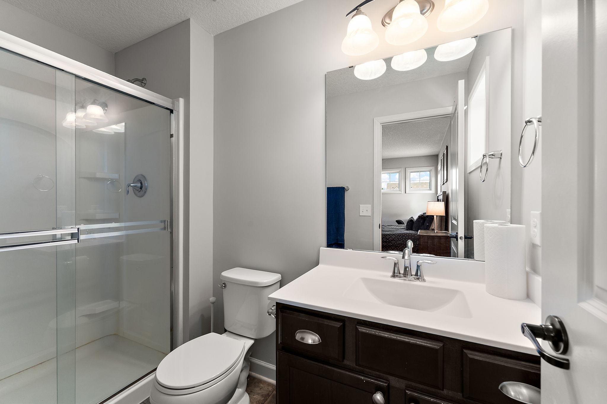 Three-quarter bath adjoins the bedroom