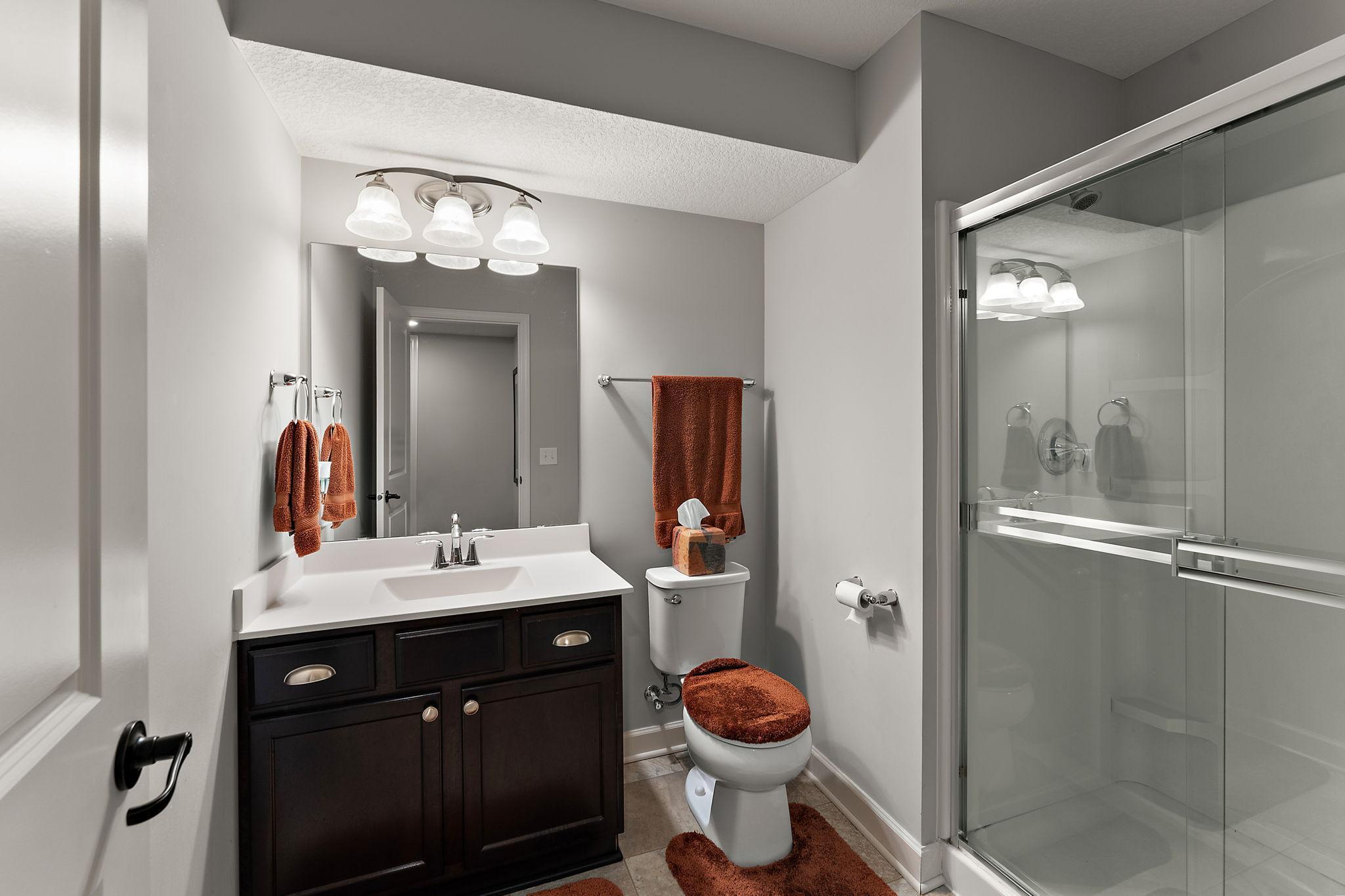 Three quarter bath is convenient for guests in the lower level