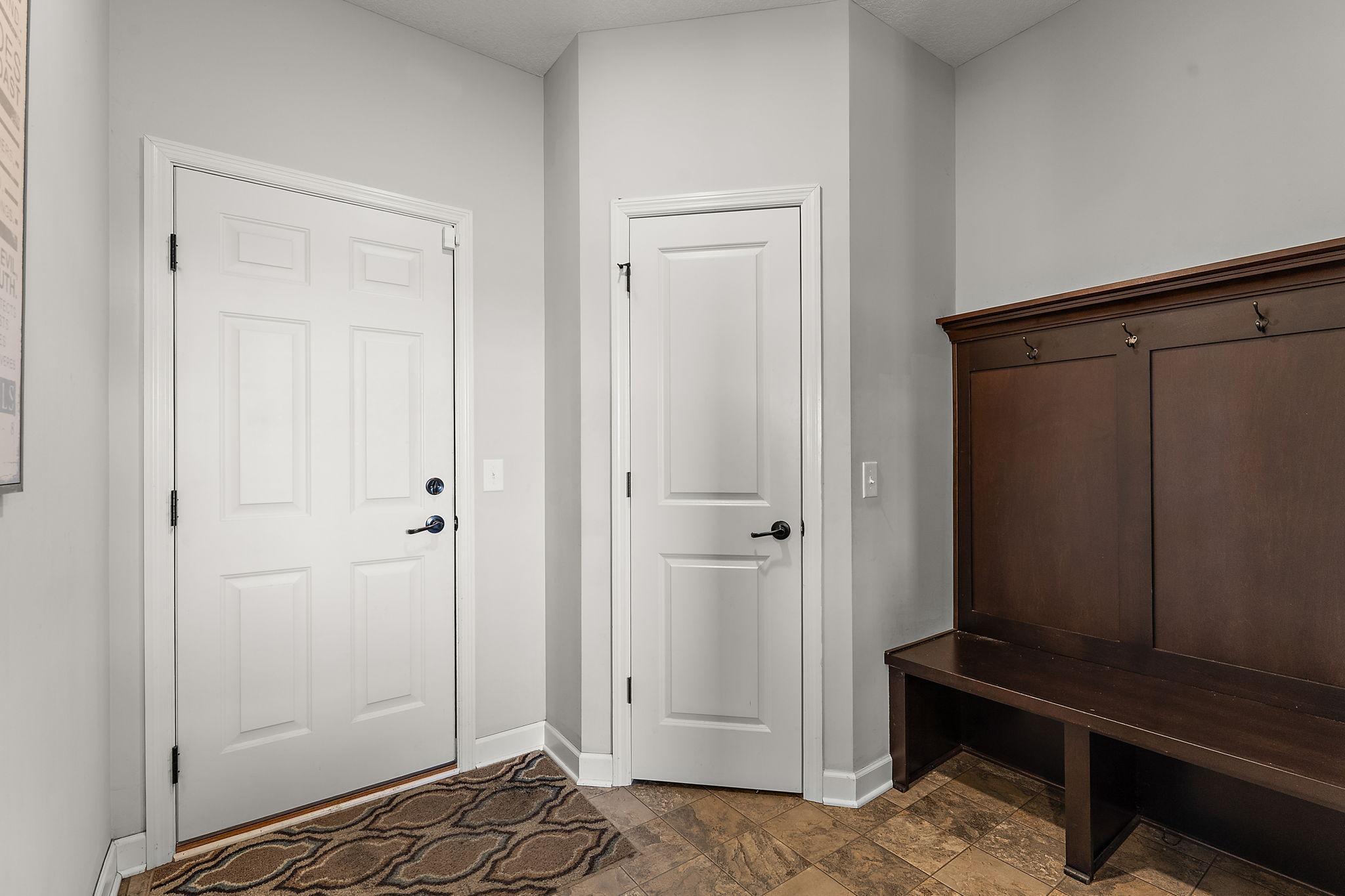 Just off the garage is the mudroom, complete with locker bench and closet