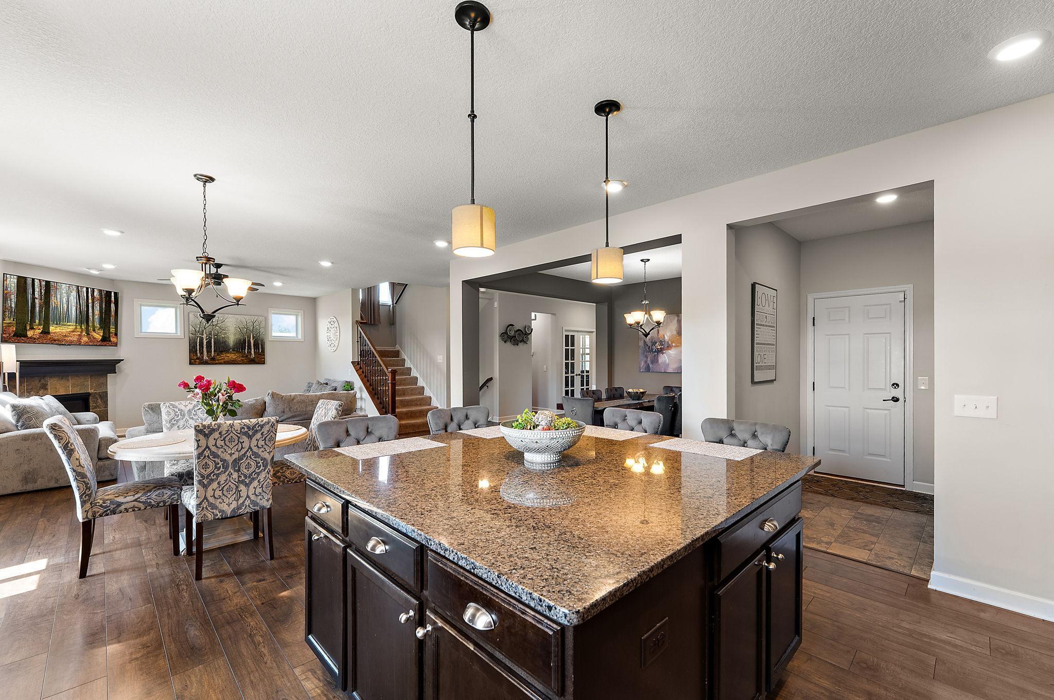 This huge granite island makes cooking a breeze with so much room! Wait for all the holiday baking!!