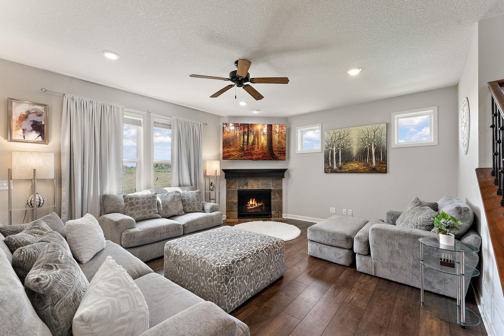 Plenty of natural light with large windows! Fireplace keeps the rainy days cozy!