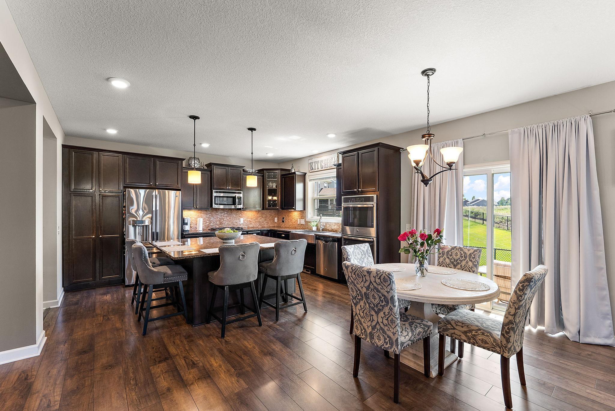 Eating options at the large island or the dining room. Or, enjoy a BBQ out on the cement patio!