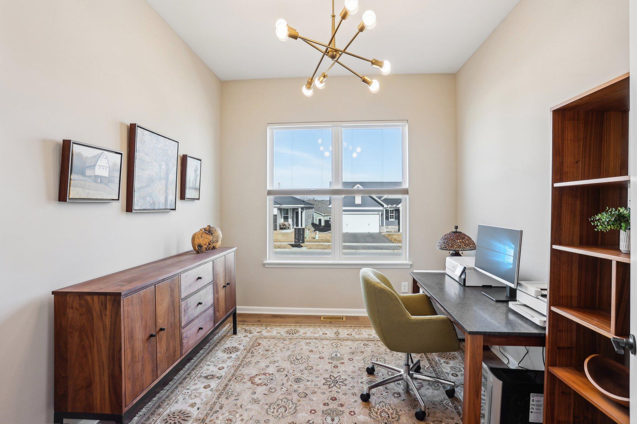 This well-designed office area offers a quiet and organized space, perfect for working or studying.