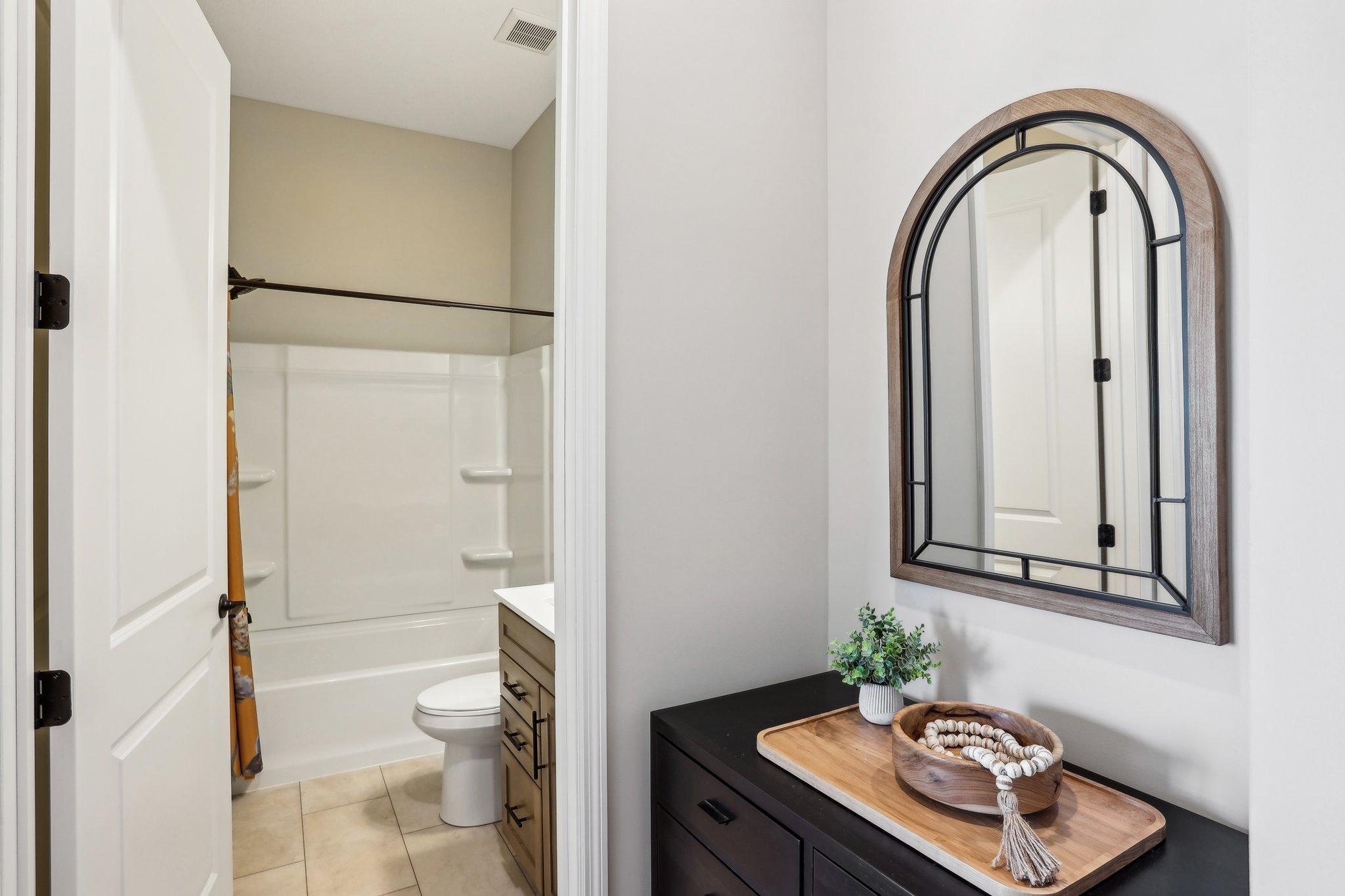 Full bathroom with tub/shower combination.