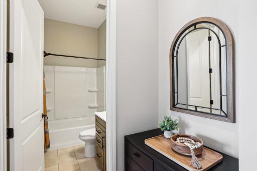 Full bathroom with tub/shower combination.