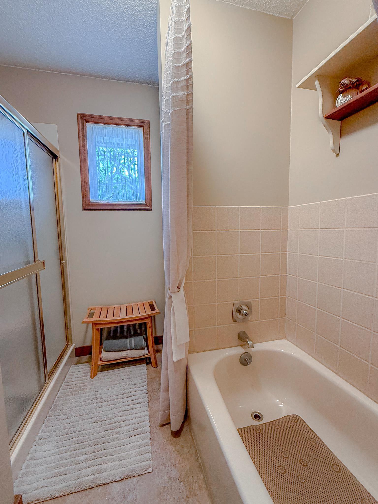 Main floor bathroom has stand alone tub and shower
