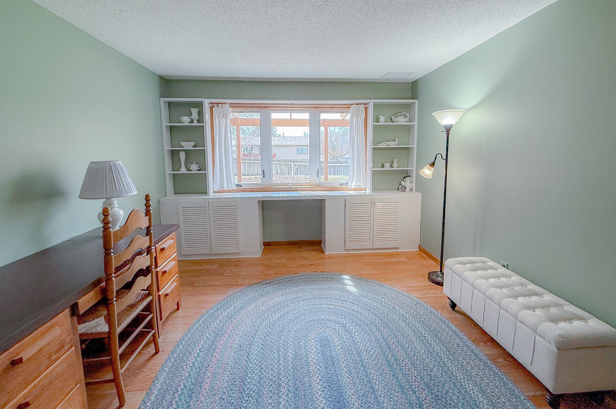 Custom built-in cabinets and shelving in lower level