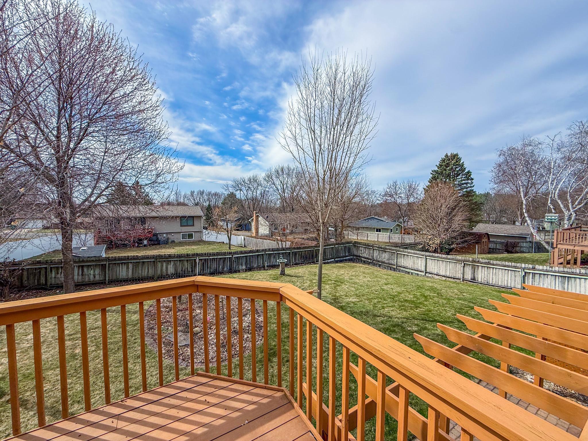 Deck overlooks backyard
