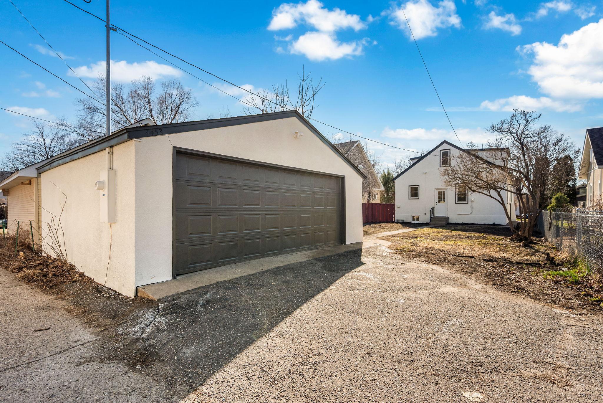 Oversized 2 car garage with it's own separate 200 amp panel! Perfect for a workshop, pottery studio, or add in EV chargers! 4453 44th Ave S, Minneapolis, MN 55406