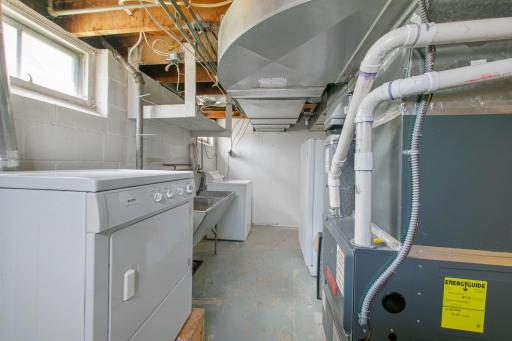 Laundry and utility room in the basement. The furnace was installed in 2021