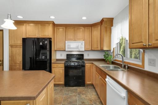 Kitchen equipped with a gas range ideal for cooking enthusiasts.