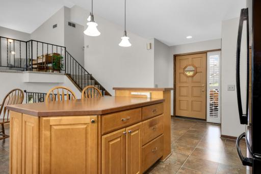 Large center island with custom design and added storage.